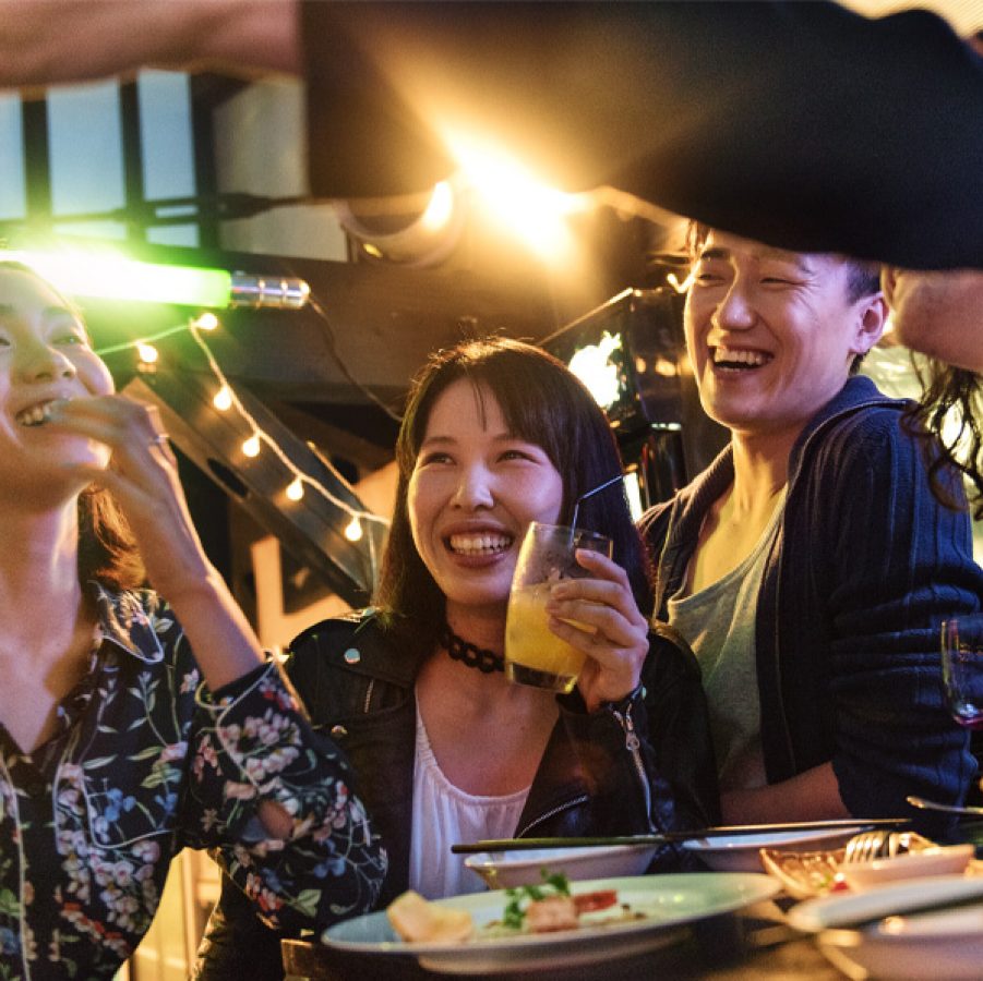 Group enjoying a meal and drinks