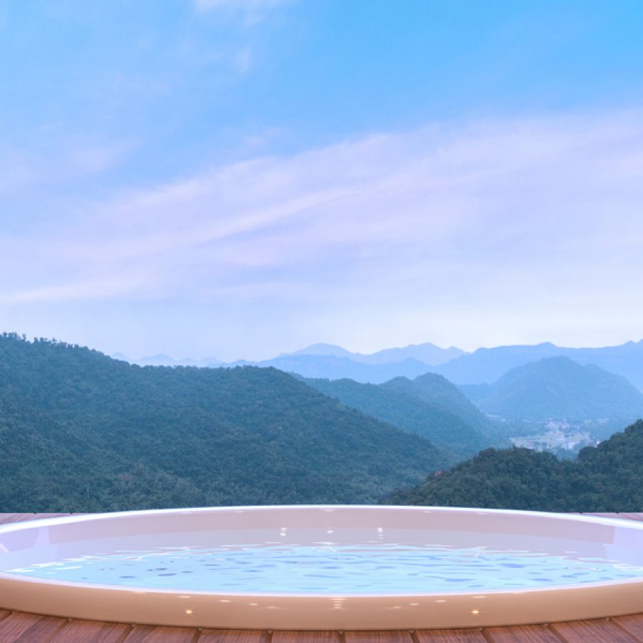 Hot tub in front of mountains