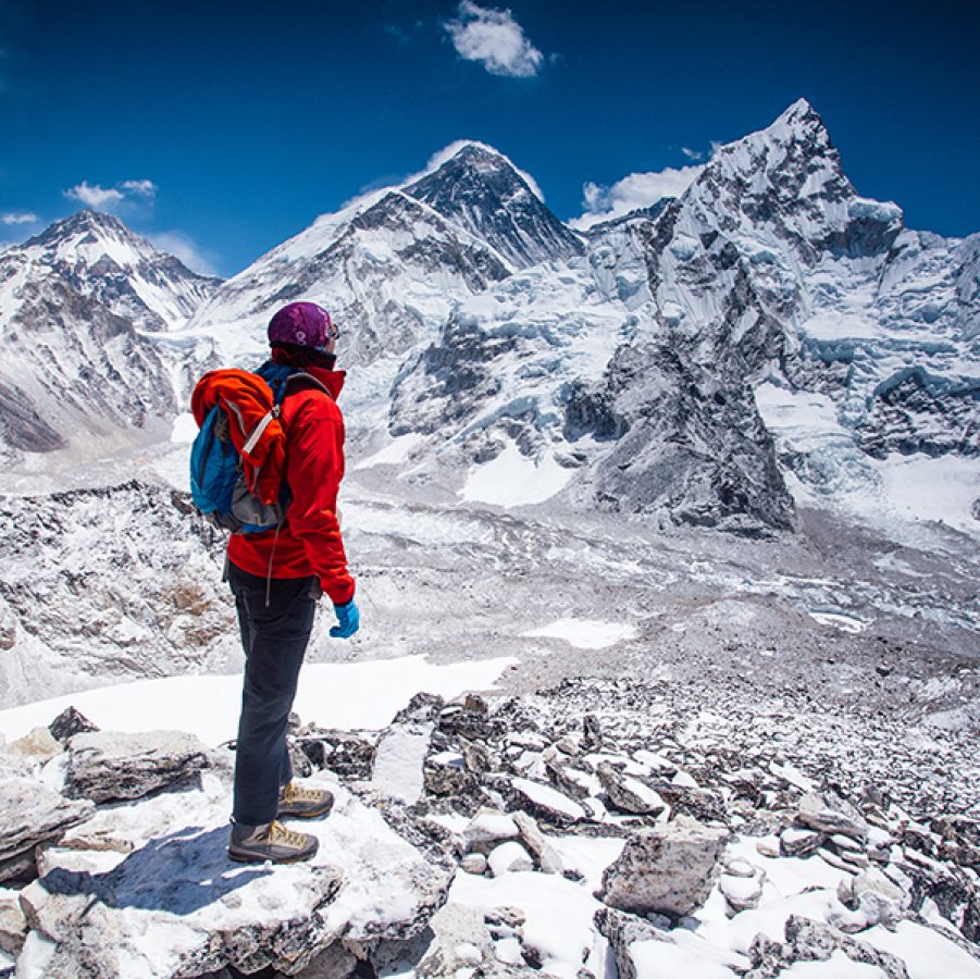Person hiking in snow in The Himalayas, Nepal 
