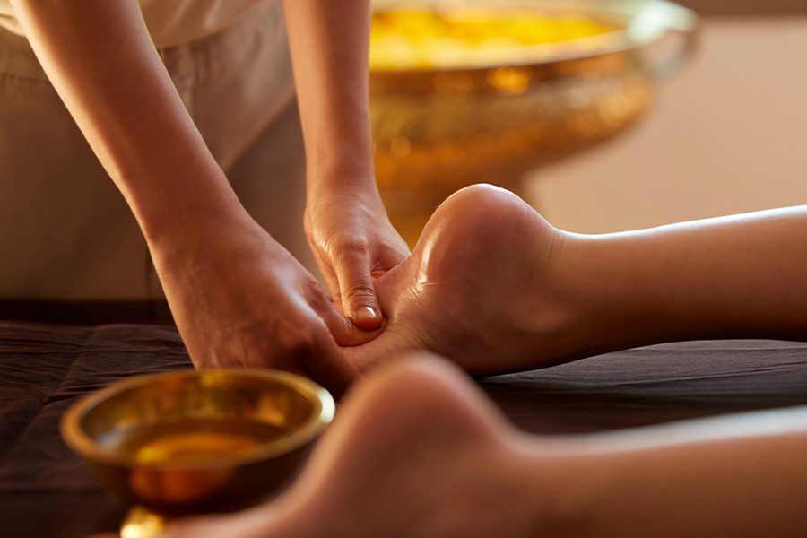 Foot massage in Rakxa Integrative Wellness, Bangkok, Thailand 