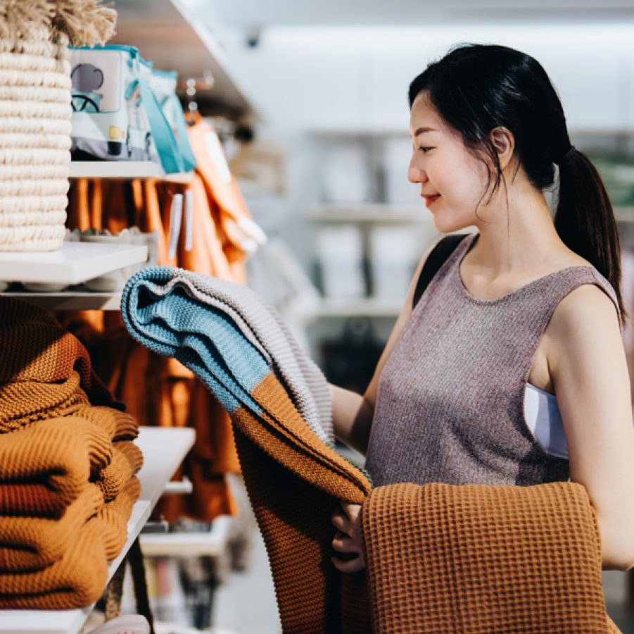Woman browsing clothes in a store
