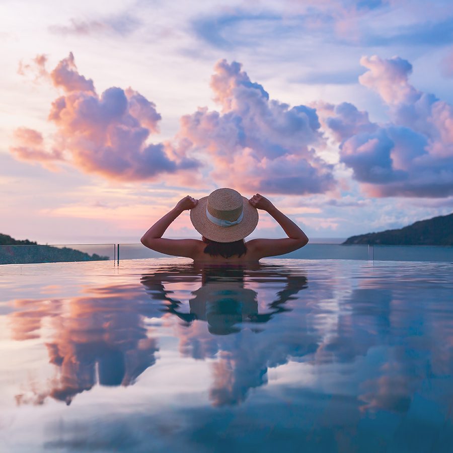 A person relaxing in a pool in Phuket, Thailand 