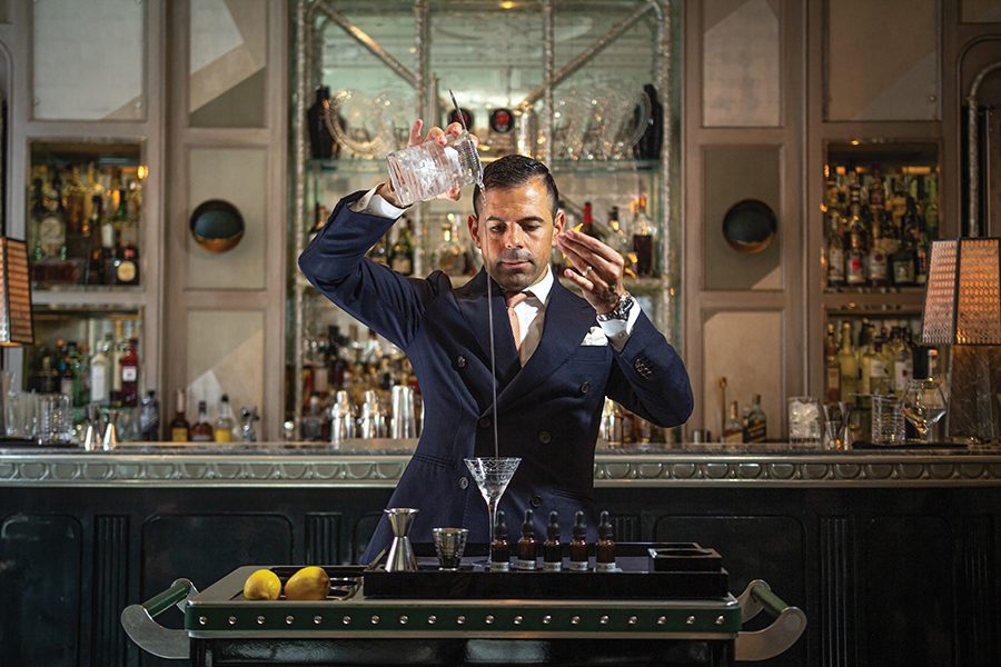 Agostino Perrone, Master Mixologist for the Connaught Bar, making a martini with the Martini Trolley