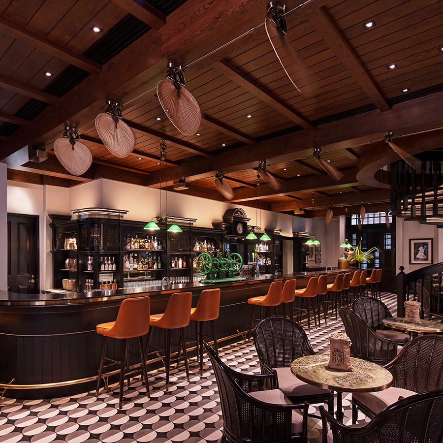 An image of the interior of Long Bar inside Raffles hotel in Singapore