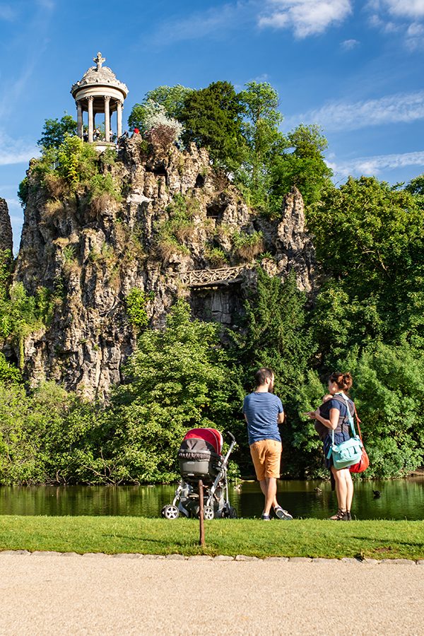 Family in front of cliff side pavilion
