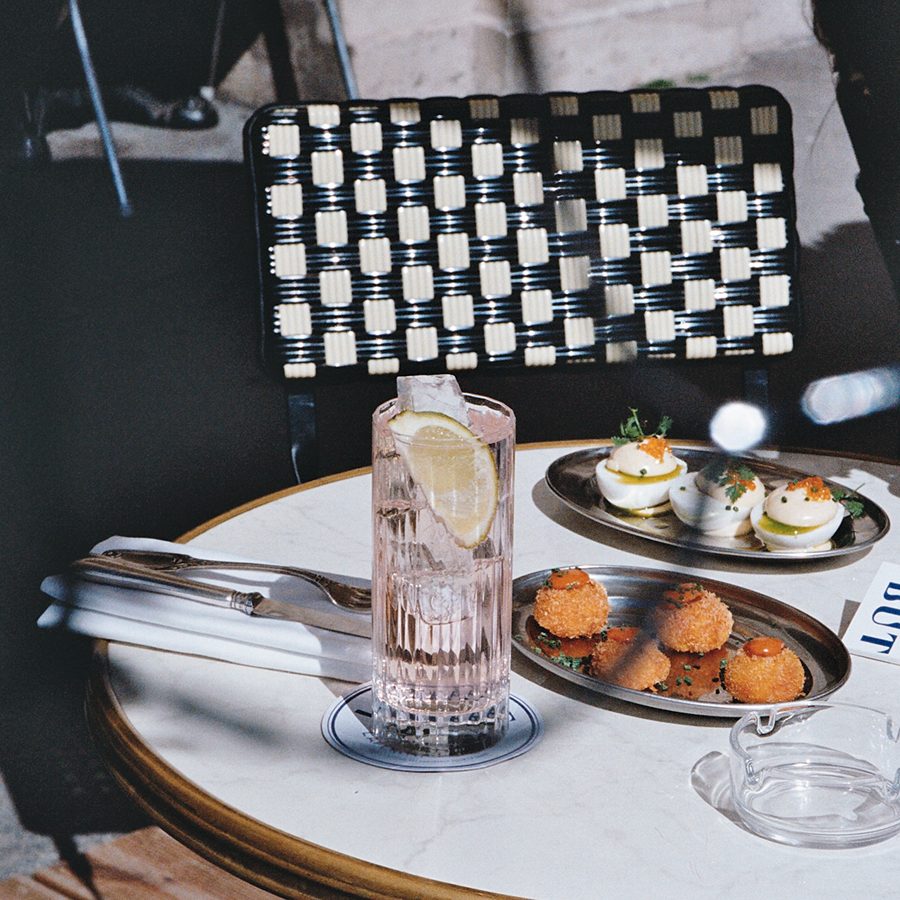 A light meal with a black and white chair in a Parisian cafe