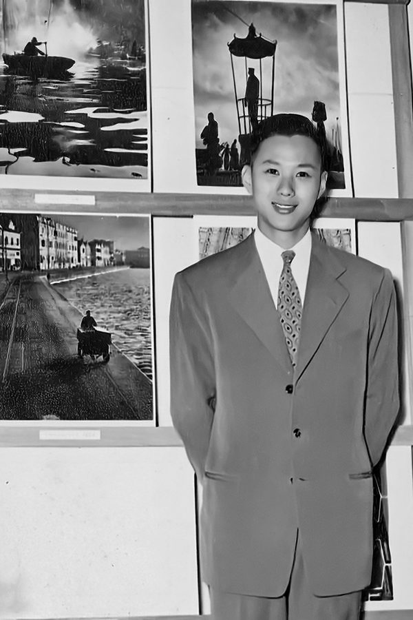 A photo of Fan Ho standing in front of the camera