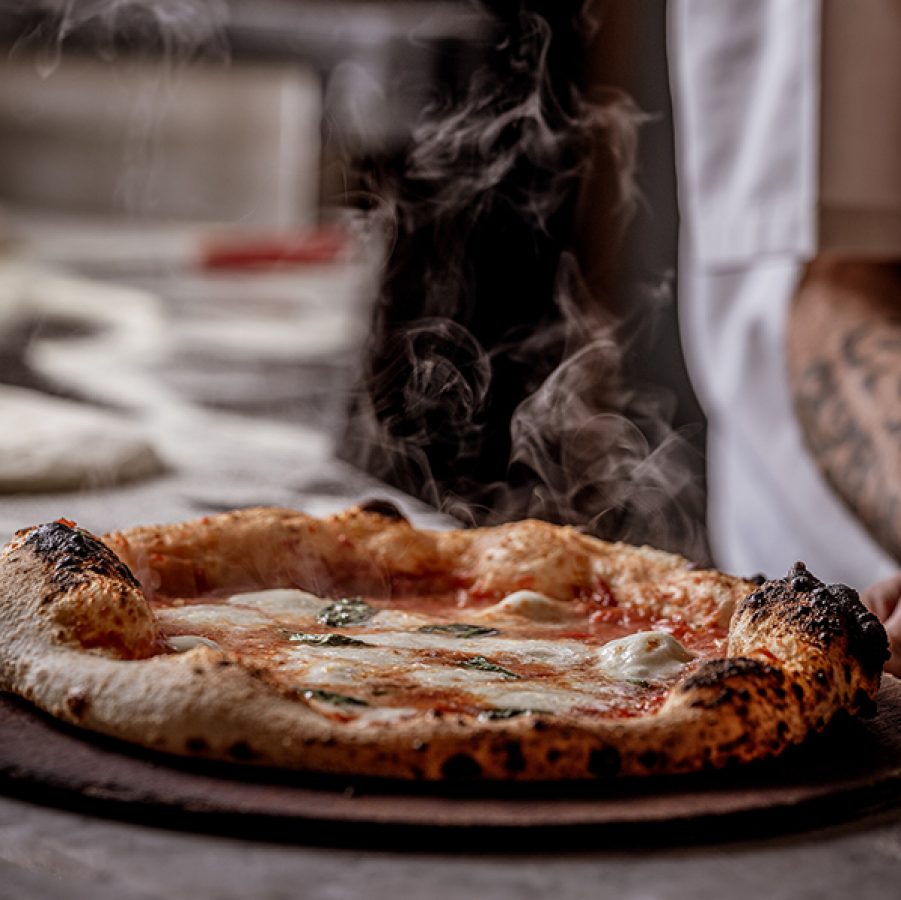 In FLAVOUR ERUPTION, the chef bakes the pizza.