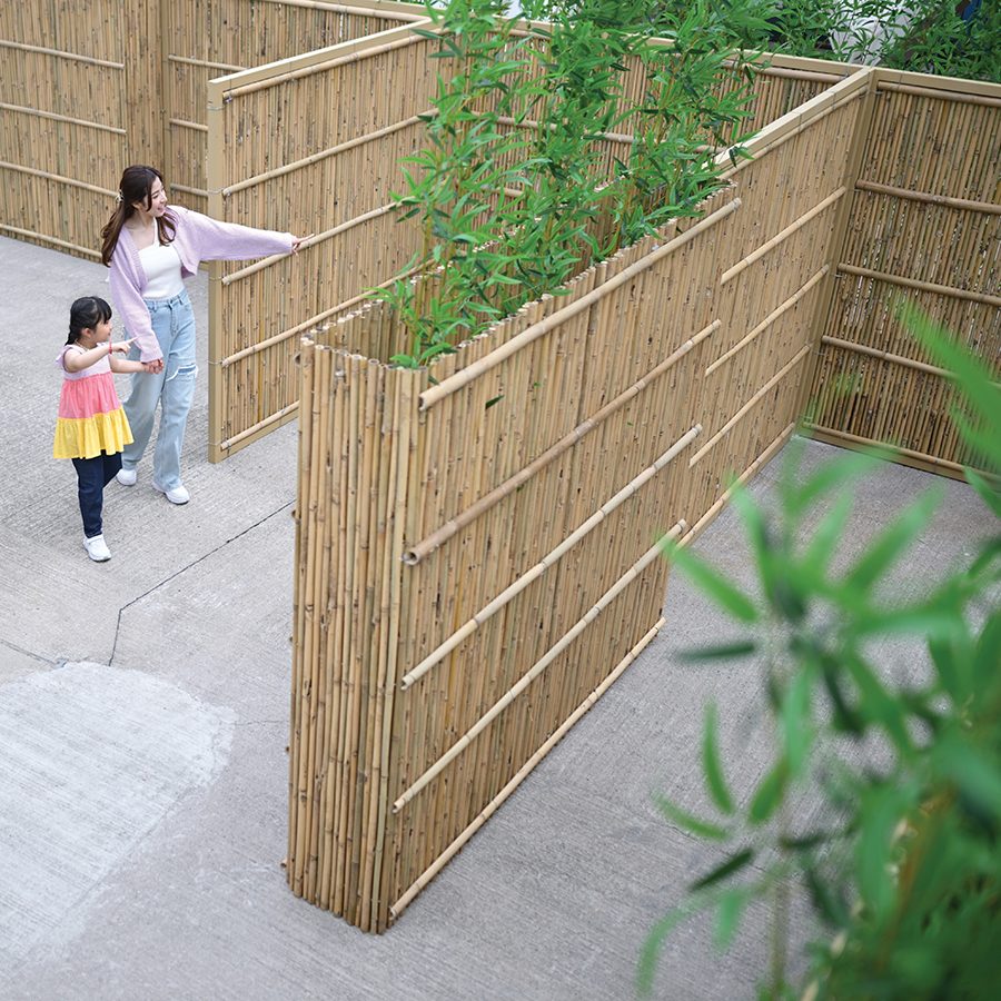 A mother is walking with her daughter at Labyrinth