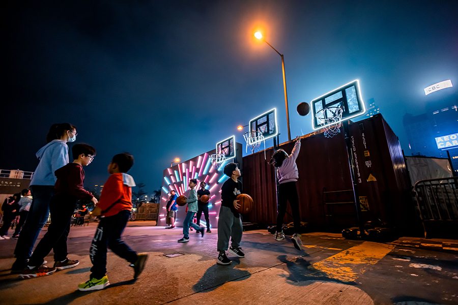 Labyrinth's night view, people are playing basketball