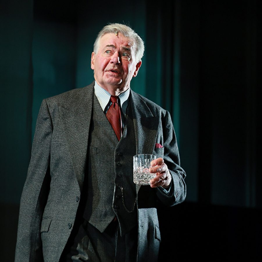 Stage shot of No Survivors with a man holding a cup.