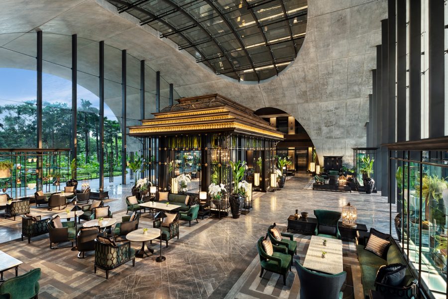 A view of the large open space lobby inside Sindhorn Kempinski Hotel Bangkok, Thailand