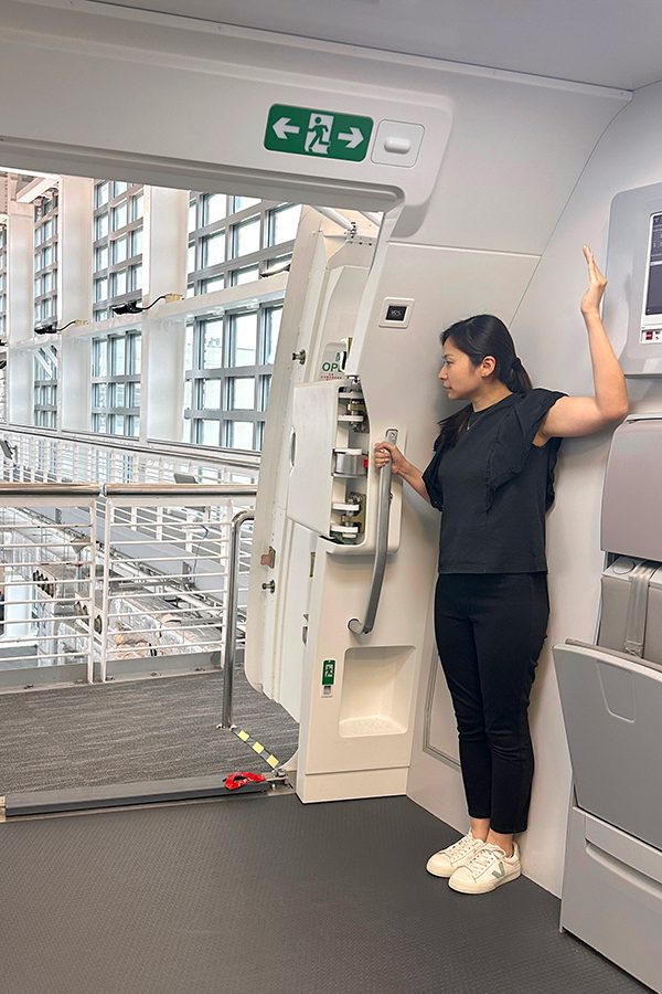 A crew member opening an aircraft door