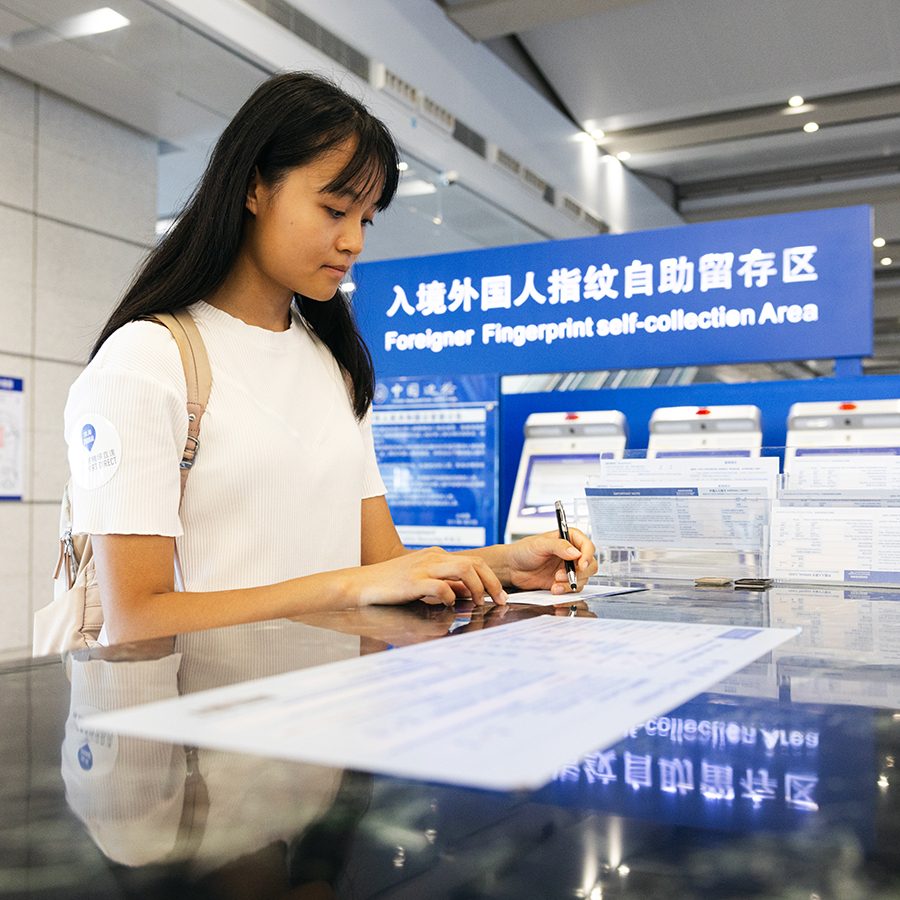 Filling out form at immigration in Zhuhai