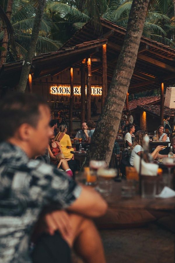 People dining outdoors at Smoke & Bitters, Sri Lanka