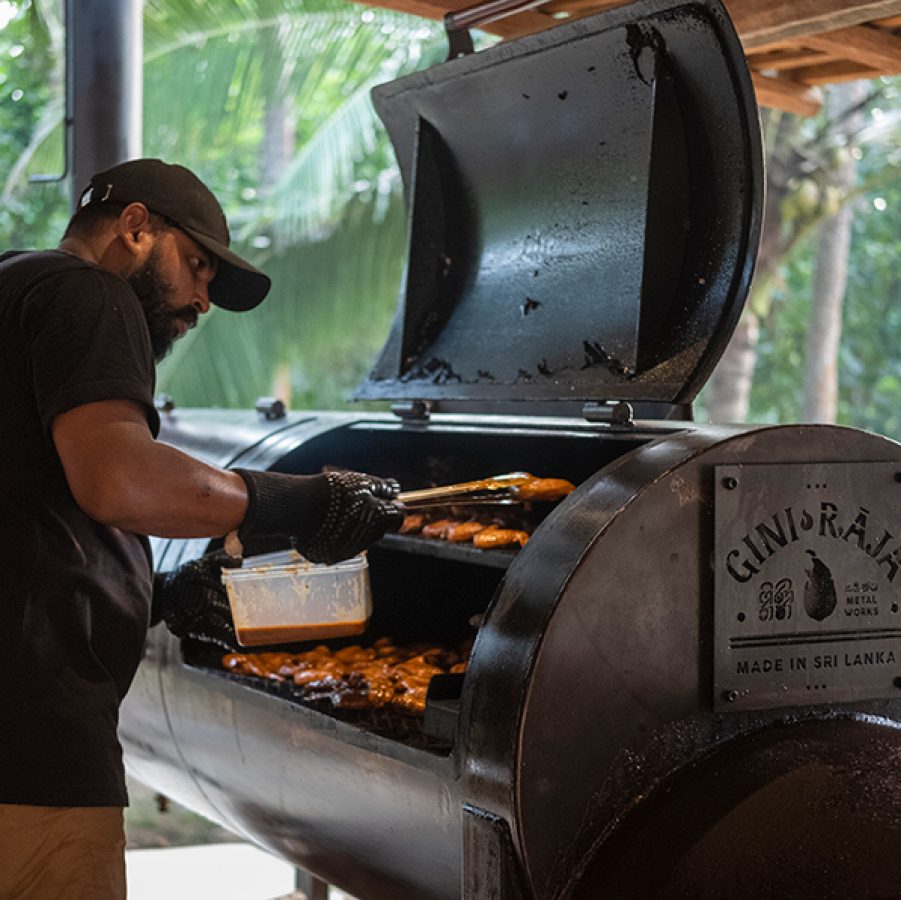 A man working at the BBQ grill at Tiki Bar in Shangri la Colombo, Sri Lanka