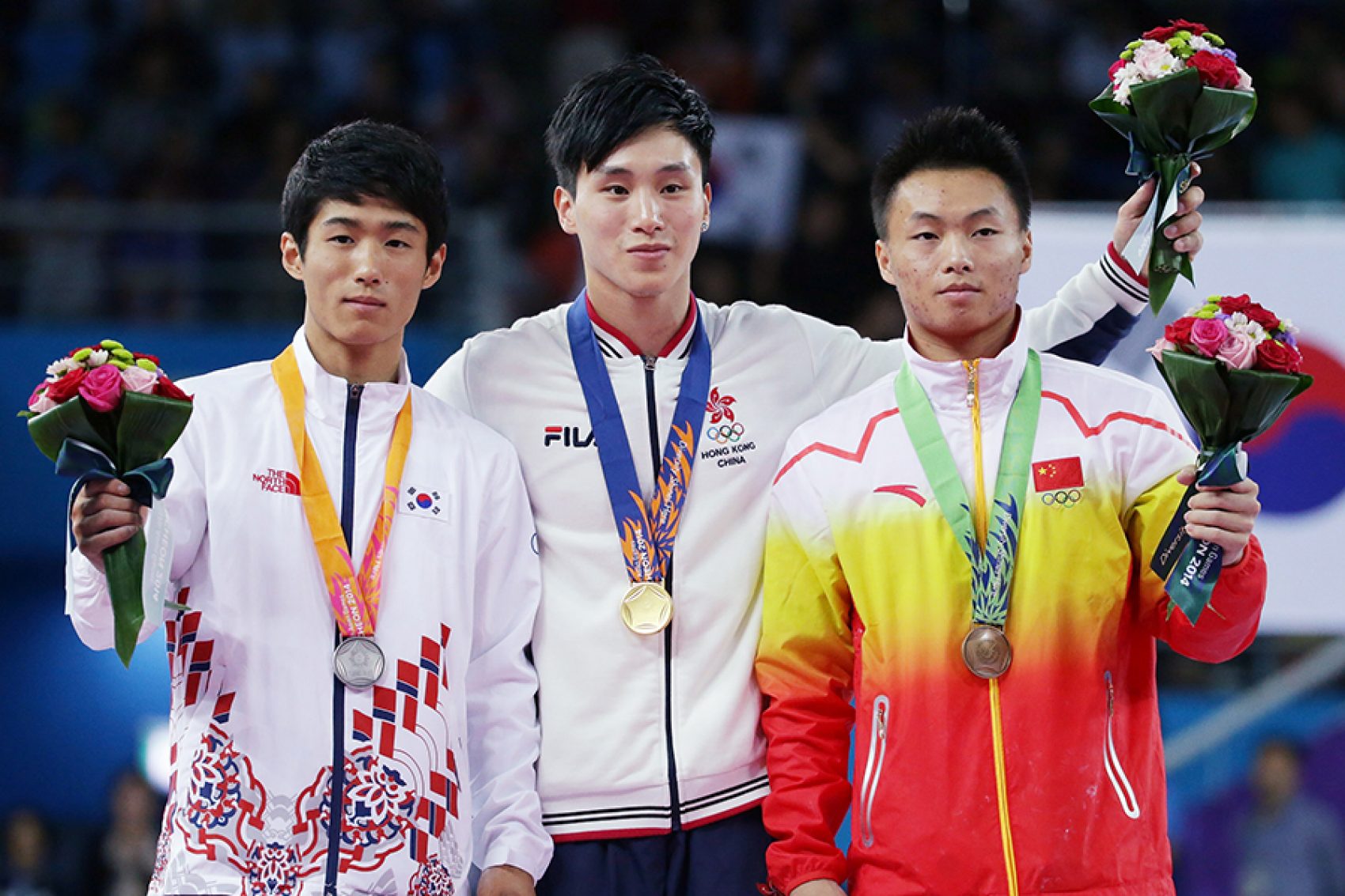 Photo of Shek Wai Hung after receiving the award with his teammates