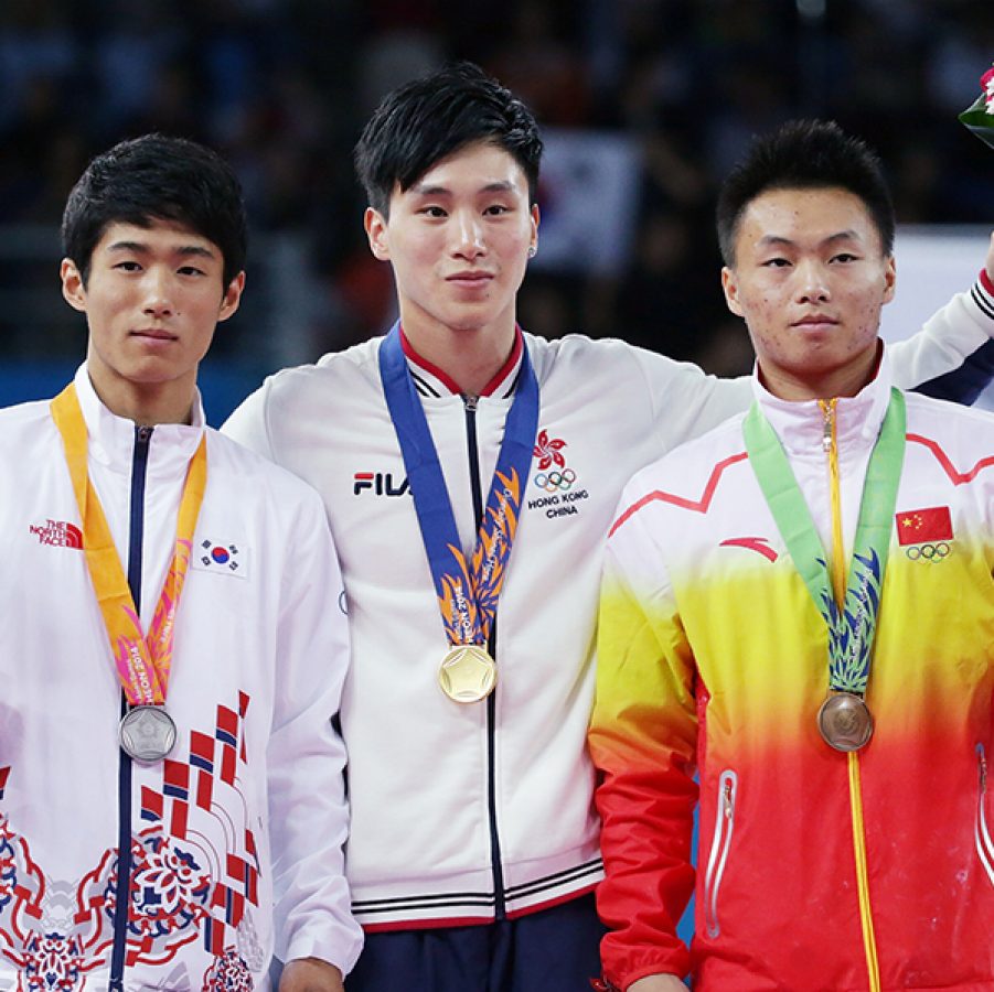Photo of Shek Wai Hung after receiving the award with his teammates