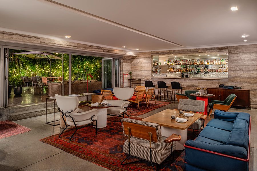 A spacious lounge with a bar and a range of seating 
