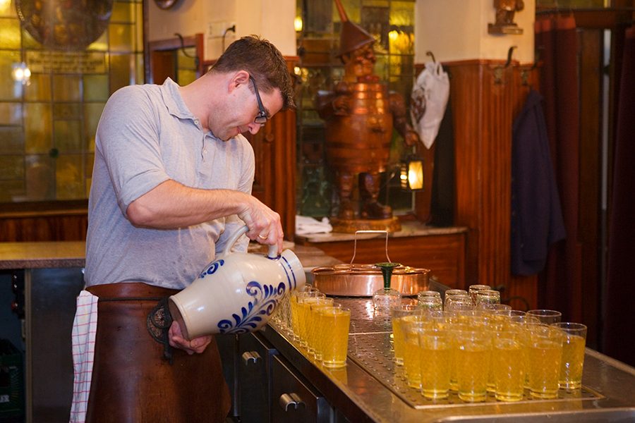 Pouring apple wine at Zum Gemalten Haus Restaurant 