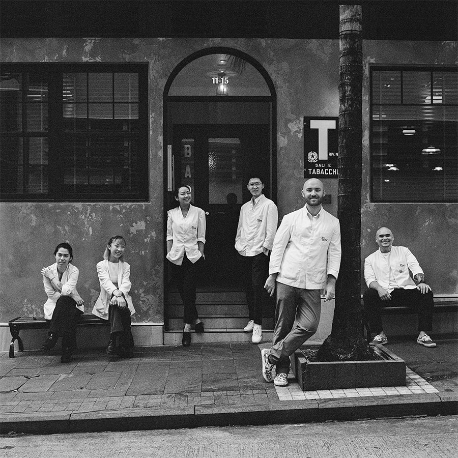 A portrait of the team outside Bar Leone, Hong Kong