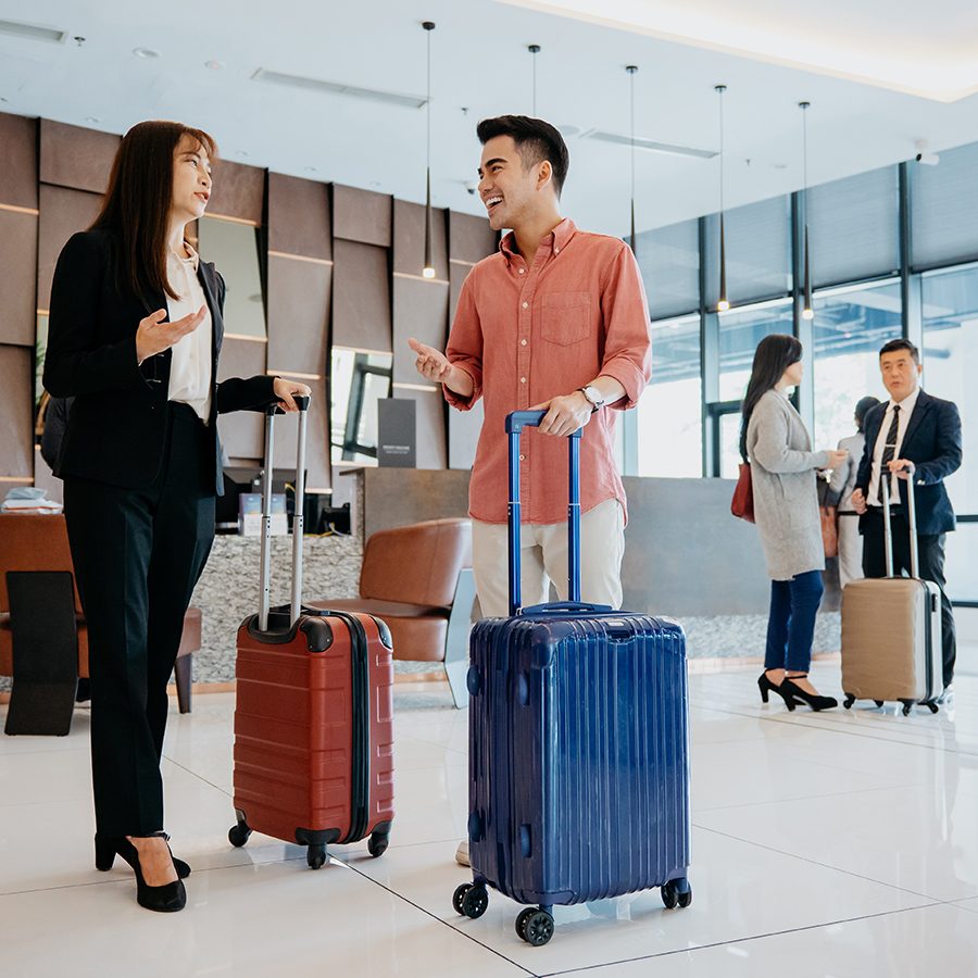 Business people having conversation at hotel lobby