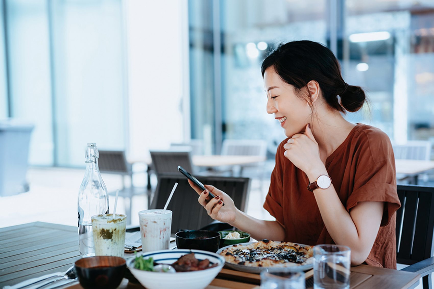 Asian woman checking social media