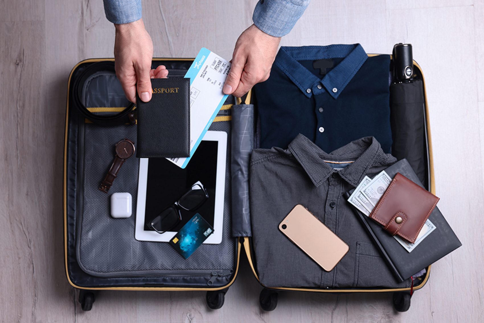 Man packing suitcase for business trip