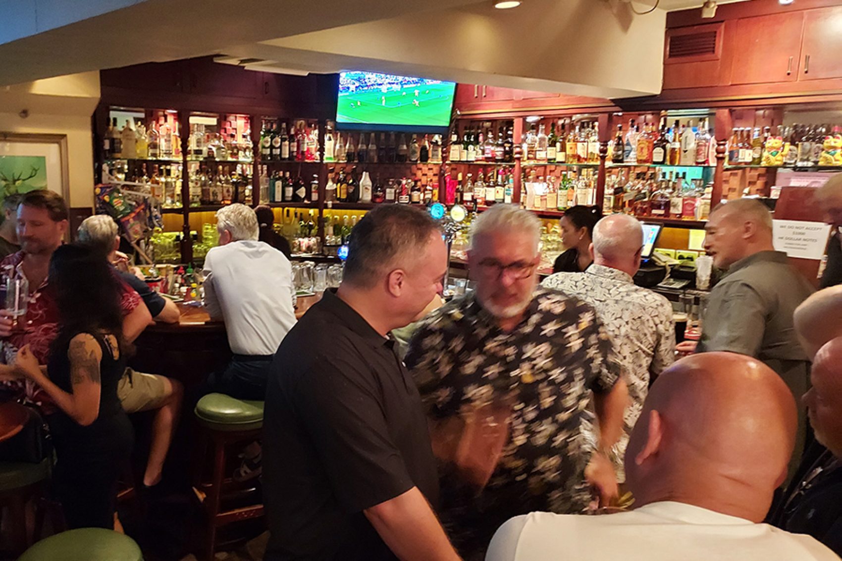 People chatting and drinking in The White Stag.
