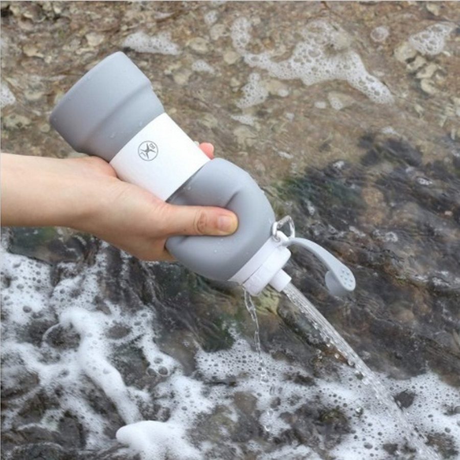 A person using a gray Silicone Bottle