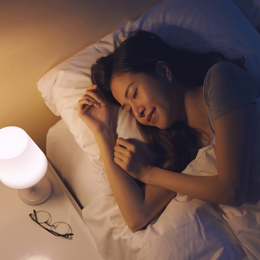 An Asian woman sleeping well at bed