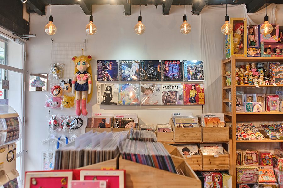 Crates and shelves of records are accompanied by toys and figurines based on Japanese manga and anime characters at Showa City Club in Sham Shui Po, Hong Kong. 