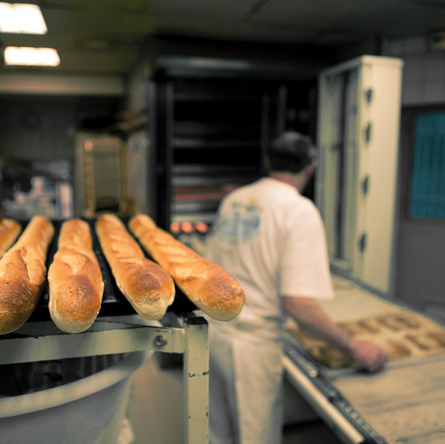 A baker making bread in Paris, France