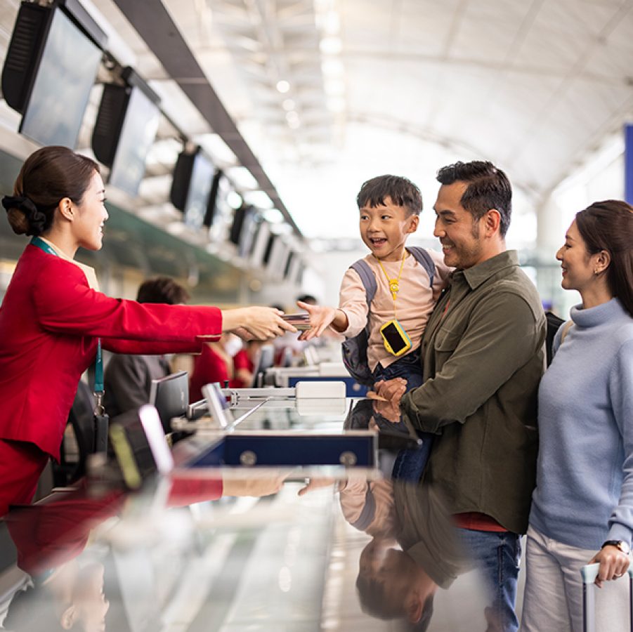 Family checking in at airport