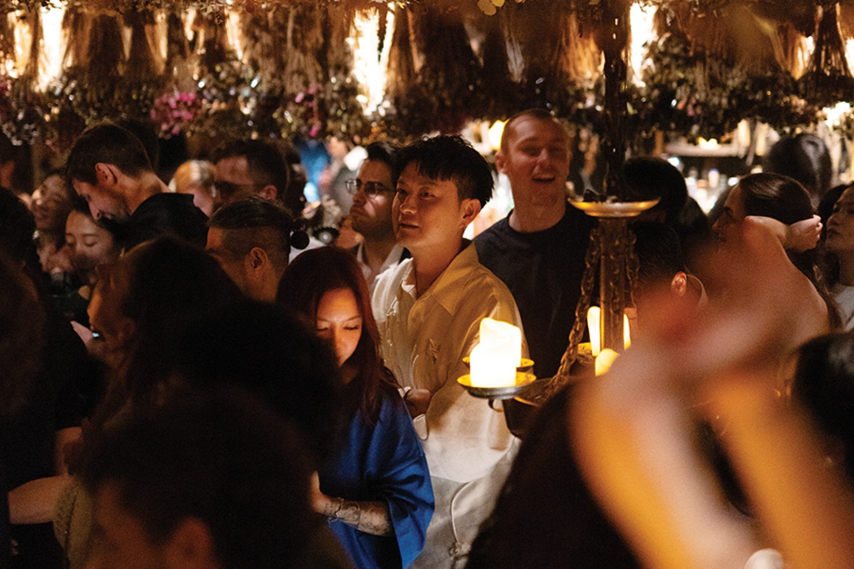 A crowd of people drinking laughing at The Iron Fairies, Hong Kong