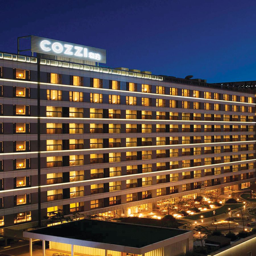 The exterior of Hotel Cozzi in the evening in Taiwan
