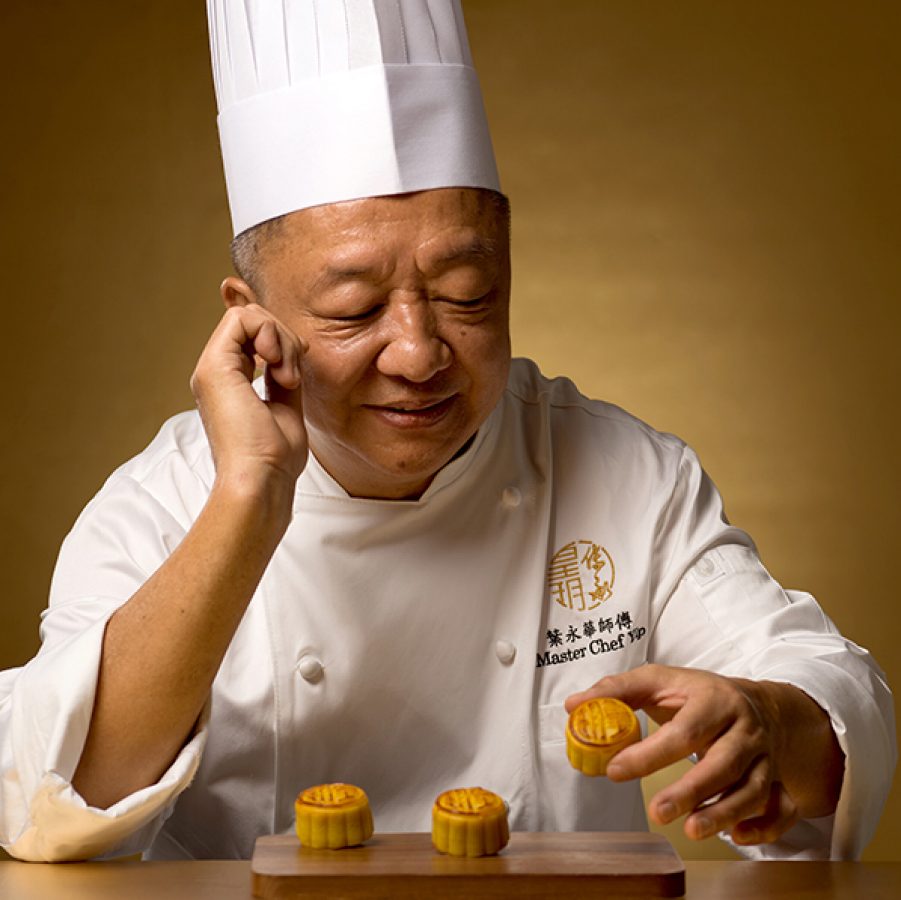 Chef Yip Wing Wah looks at the mooncake in his hand.