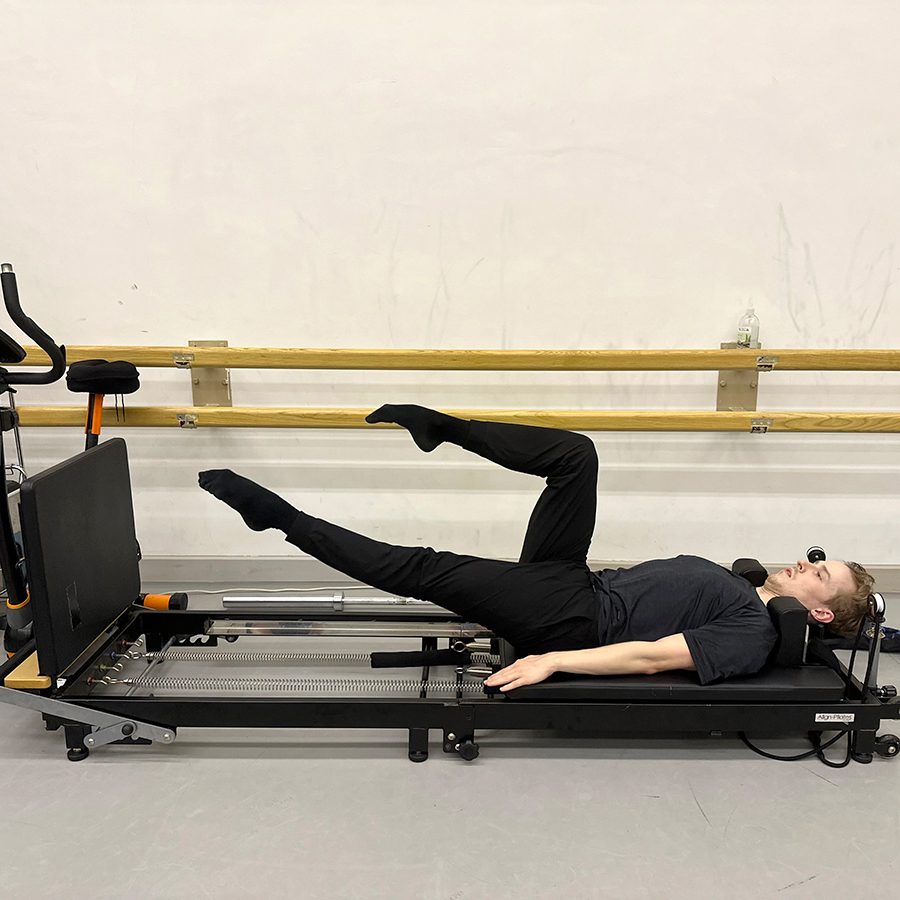 A man doing leg practice at a studio