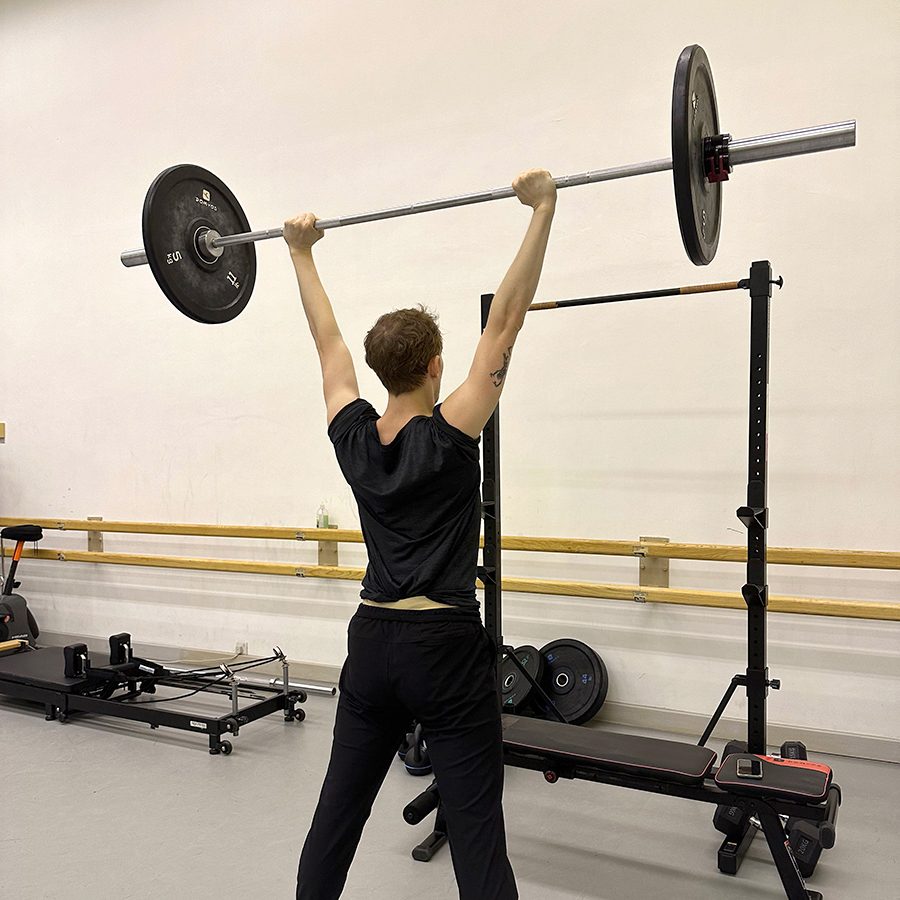 A man doing muscle practice at a studio
