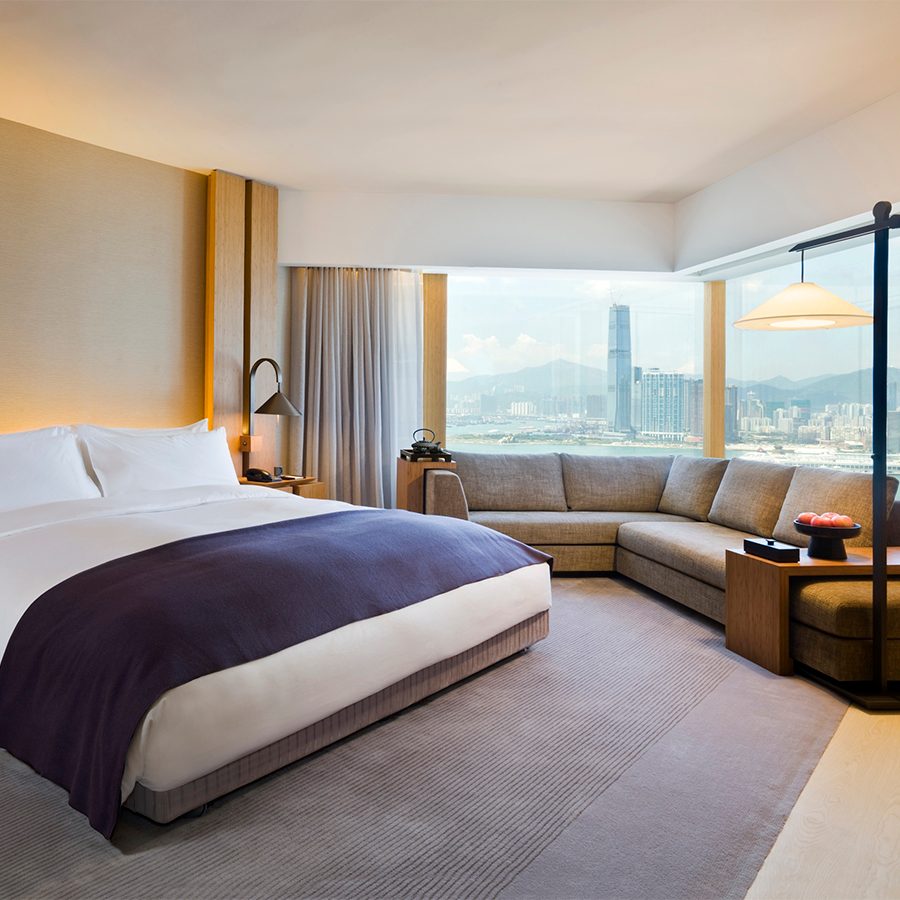 A guestroom with a large bed and window at The Upper House, Hong Kong 