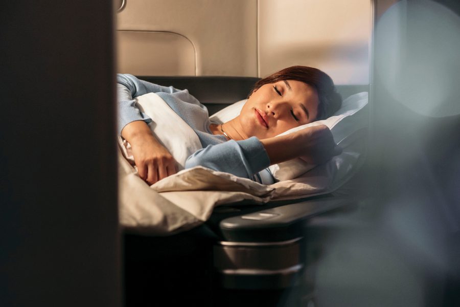 A women sleeping on a plane