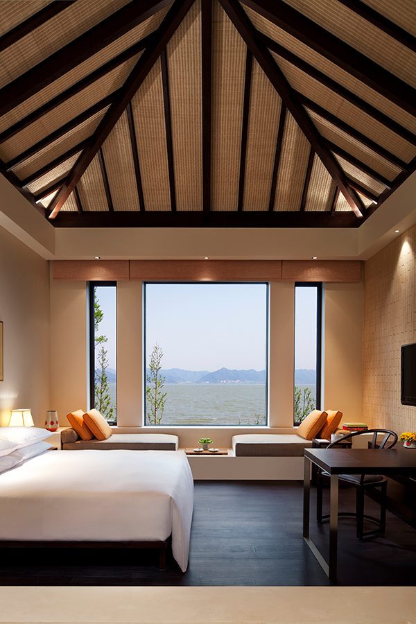 An interior photo of hotel room with a double bed