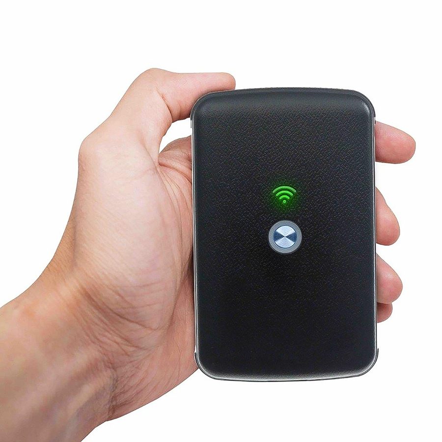 Person holding the SmartGo portable Wi-Fi hotspot 