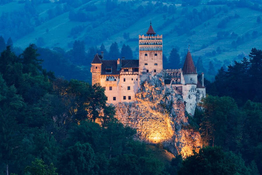 Bran Castle, Transylvania, lit up at dusk.