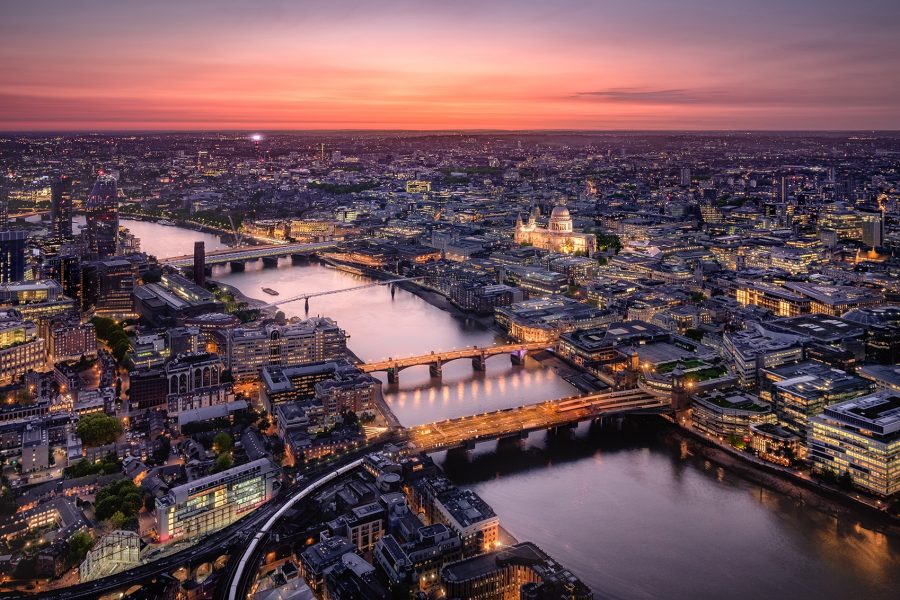 An aerial view of the River Thames and Central London at dusk