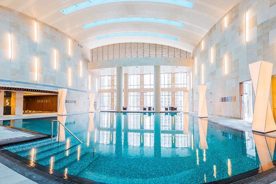 A 180 wide angle view of the brightly-lit indoor pool at InterContinental Ningbo, China 