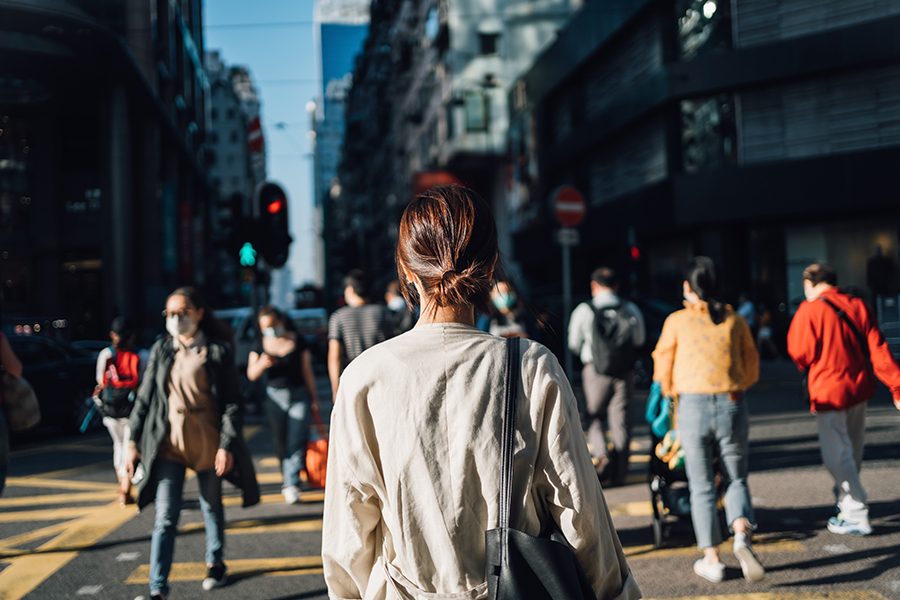 Pedestrians crossing the road in a city