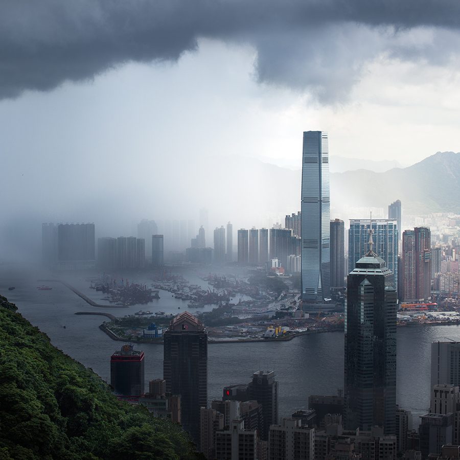 Overcast weather in Hong Kong as clouds loom over the city’s skyline and the surrounding mountains. 
