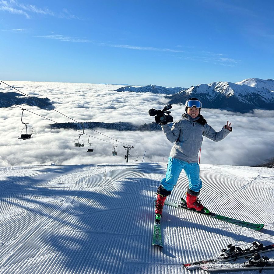 Audrey King smiling on top of a ski slope