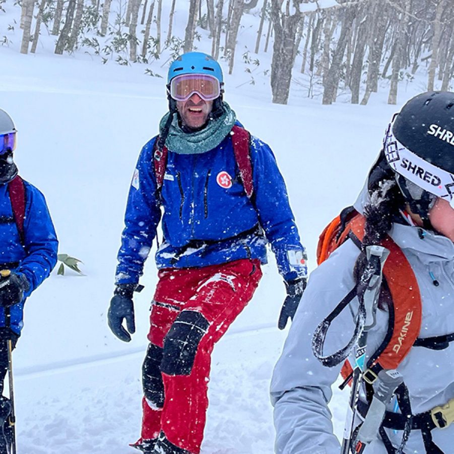 Audrey King and two others dressed in snow gear on a mountain